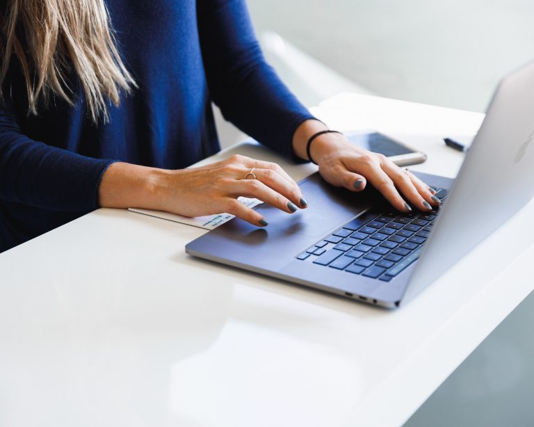 Woman typing on laptop