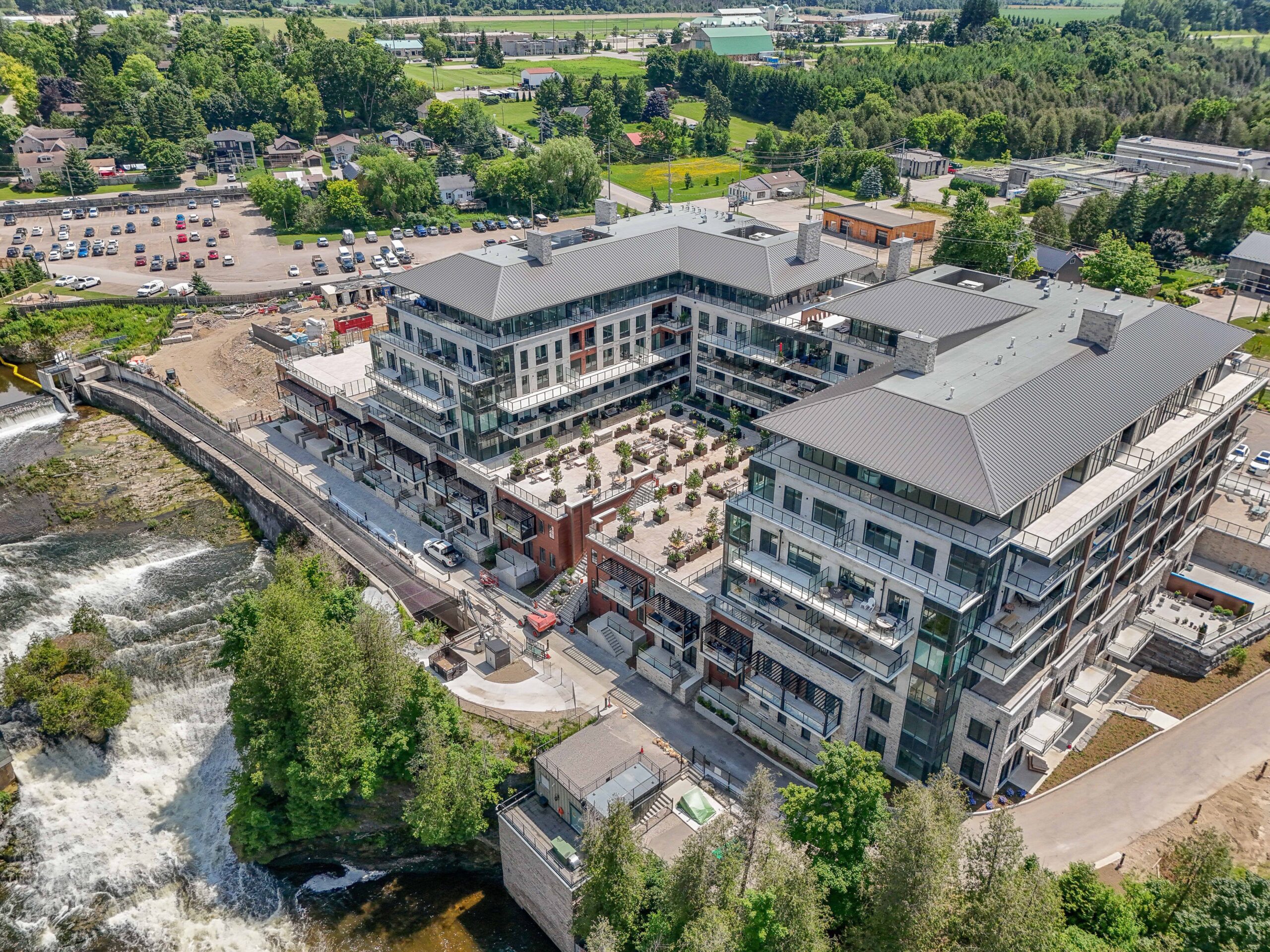 Aerial overhead photo of Elora Mill Residences beside the historic mill and waterfall