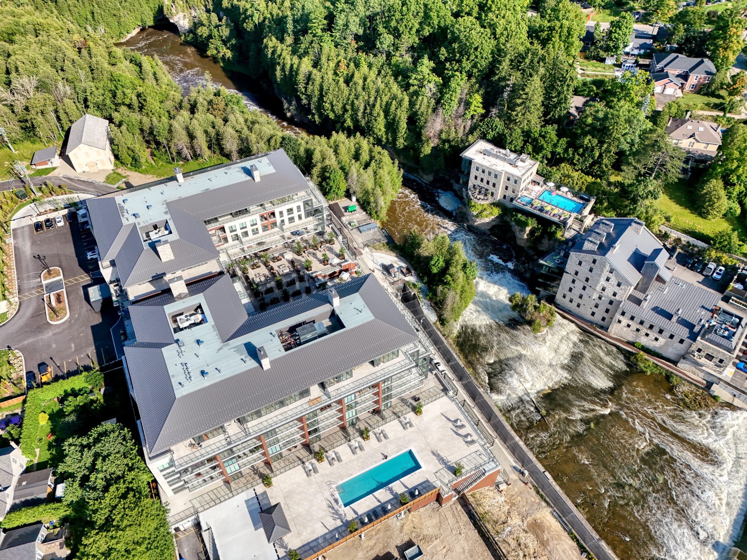 Aerial photo of Elora Mill Residences alongside the Grand River