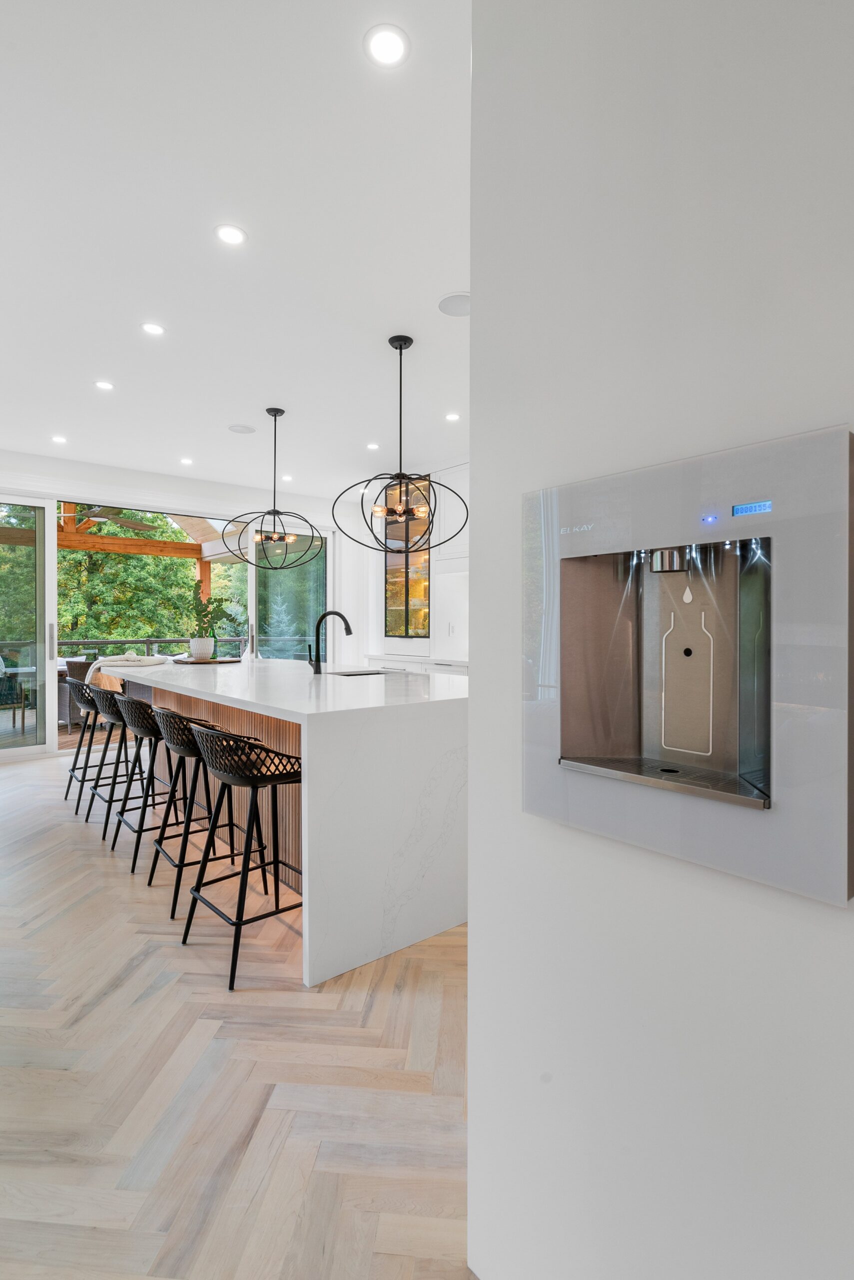 Foyer with arched window and dining nook in Heidelberg custom home