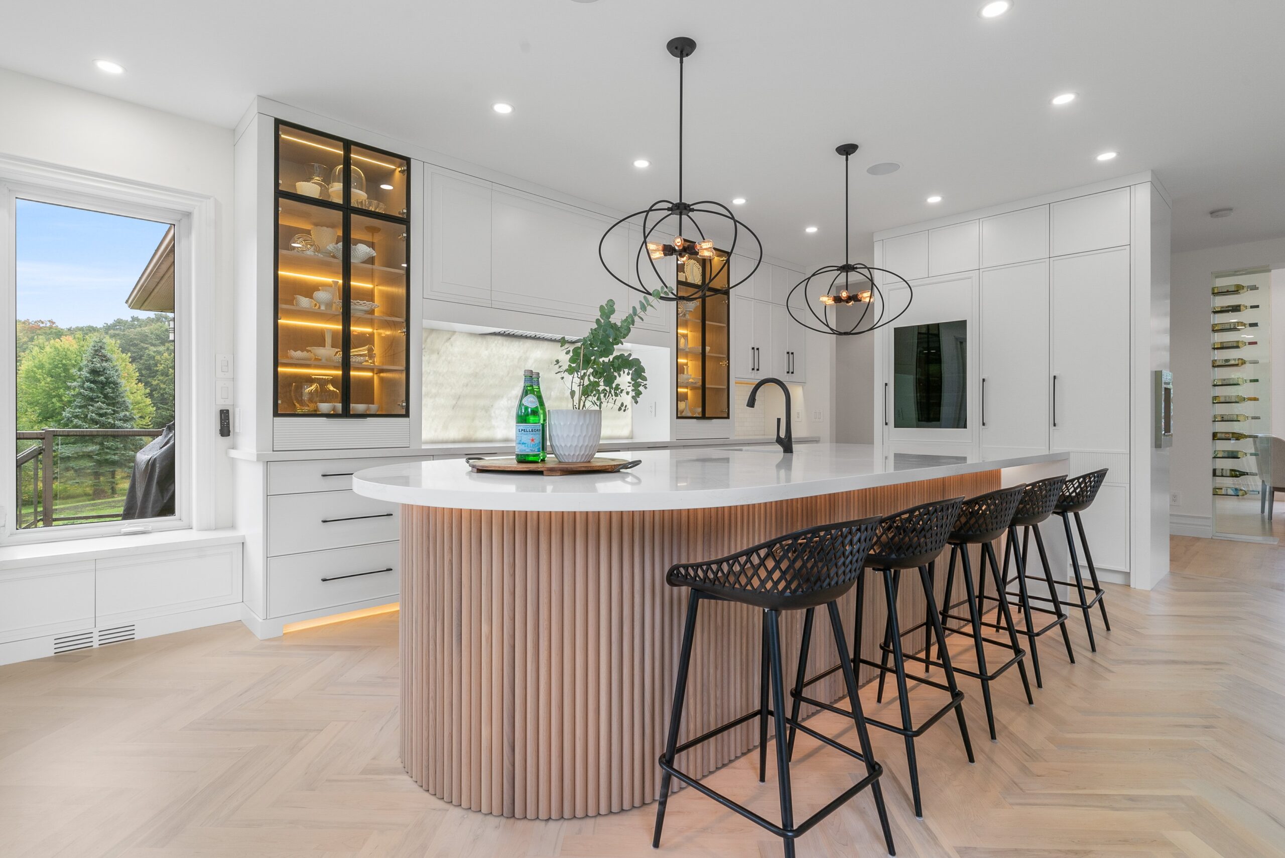 Curved ribbed wood island and chef's kitchen in Heidelberg custom home