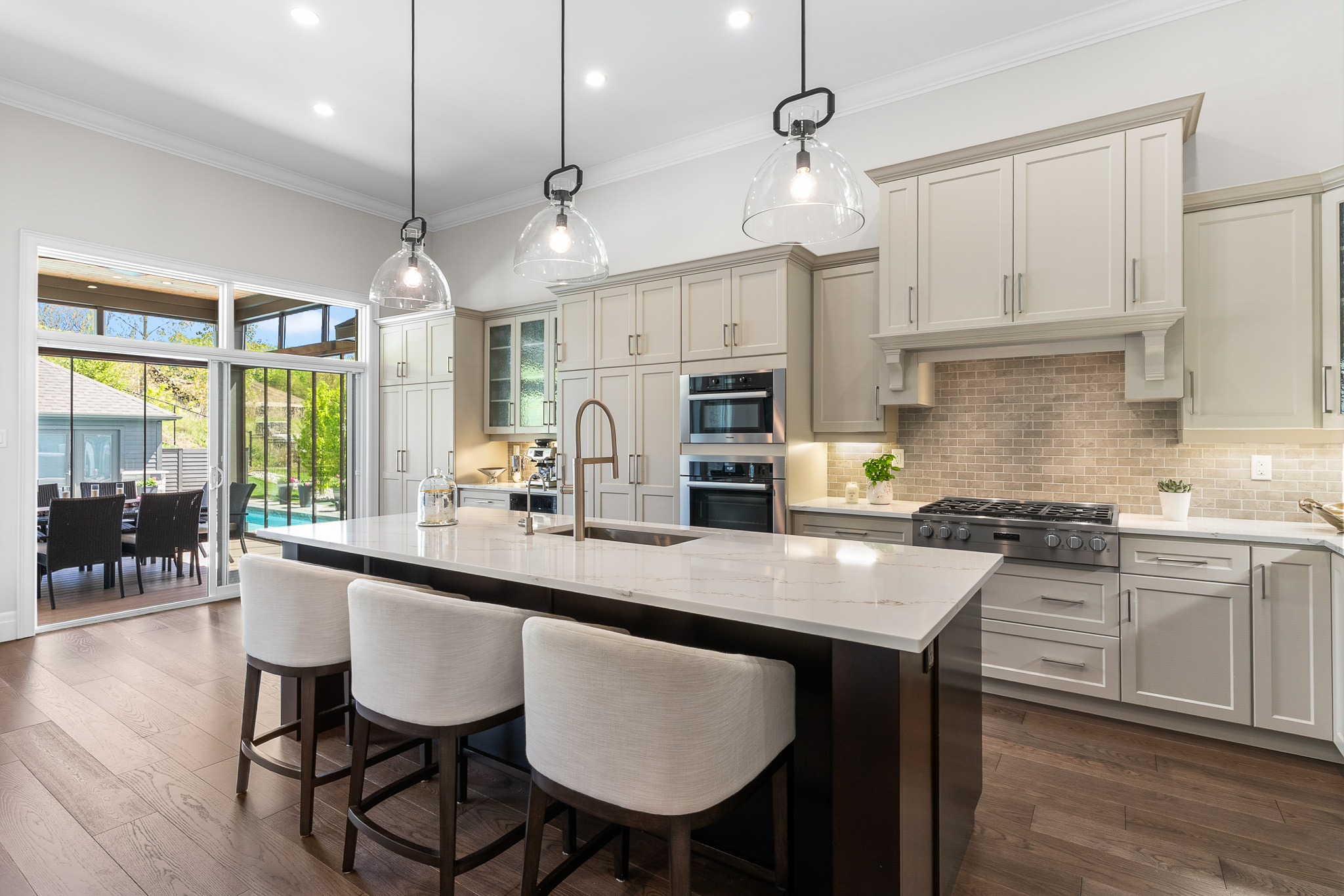 Marble kitchen island with gas range at Hidden Valley estate