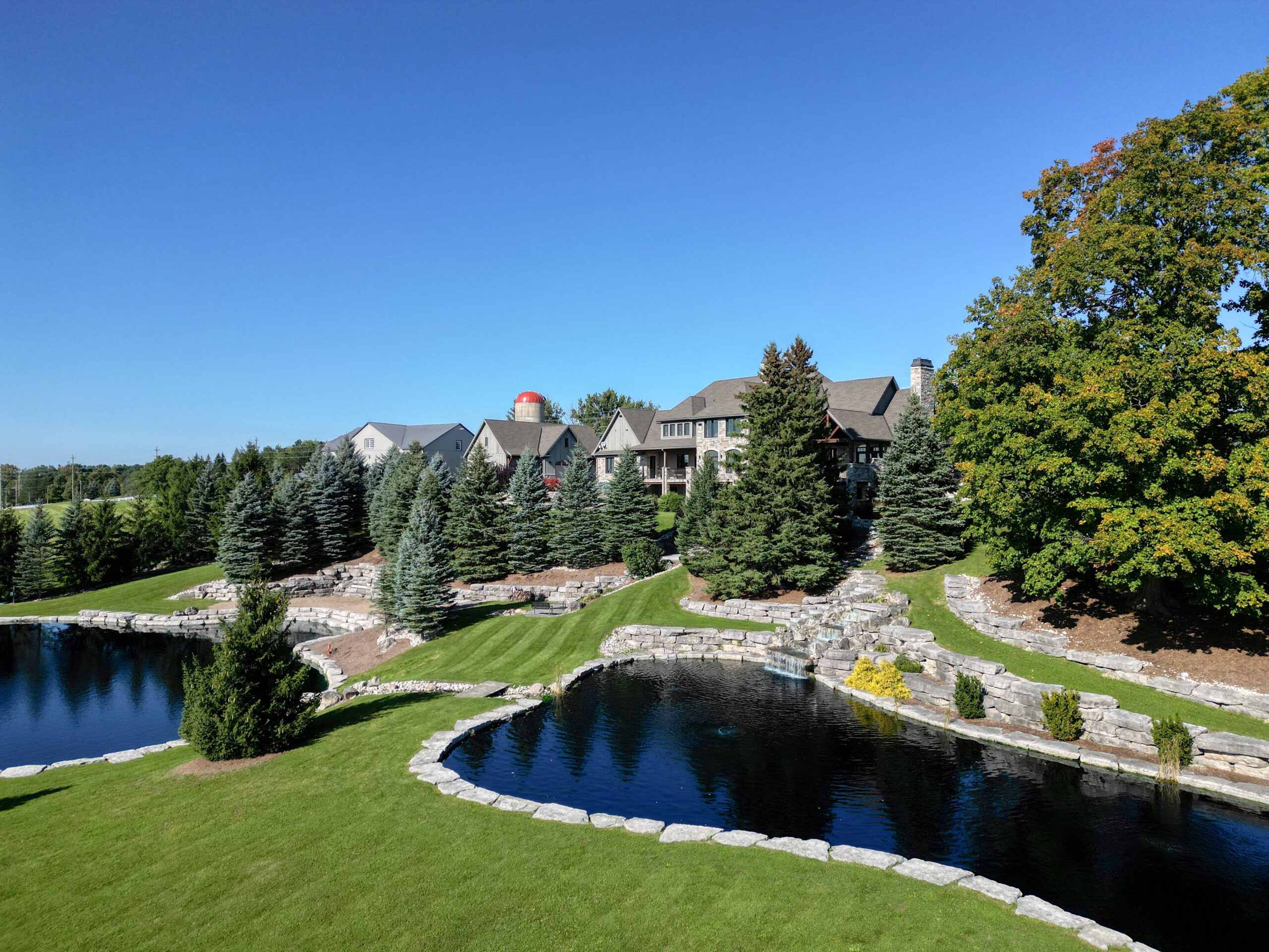 Lower-level billiards room and bar with timber beams at Waterloo estate