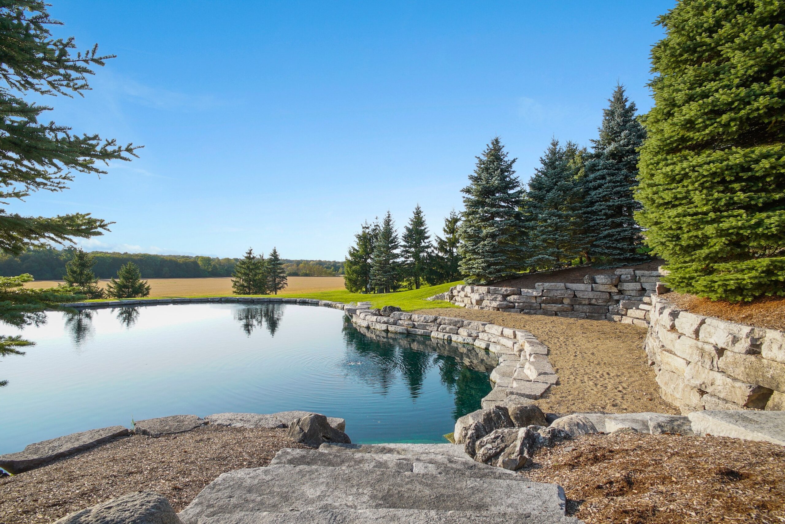 Twilight aerial photo of stone-edged ponds at the Waterloo country estate